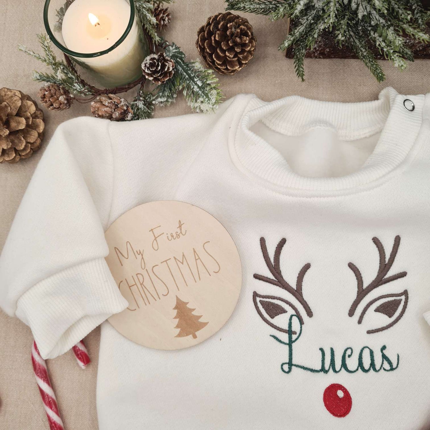 Detail of the reindeer embroidery with baby's name on the Christmas Baby Romper.