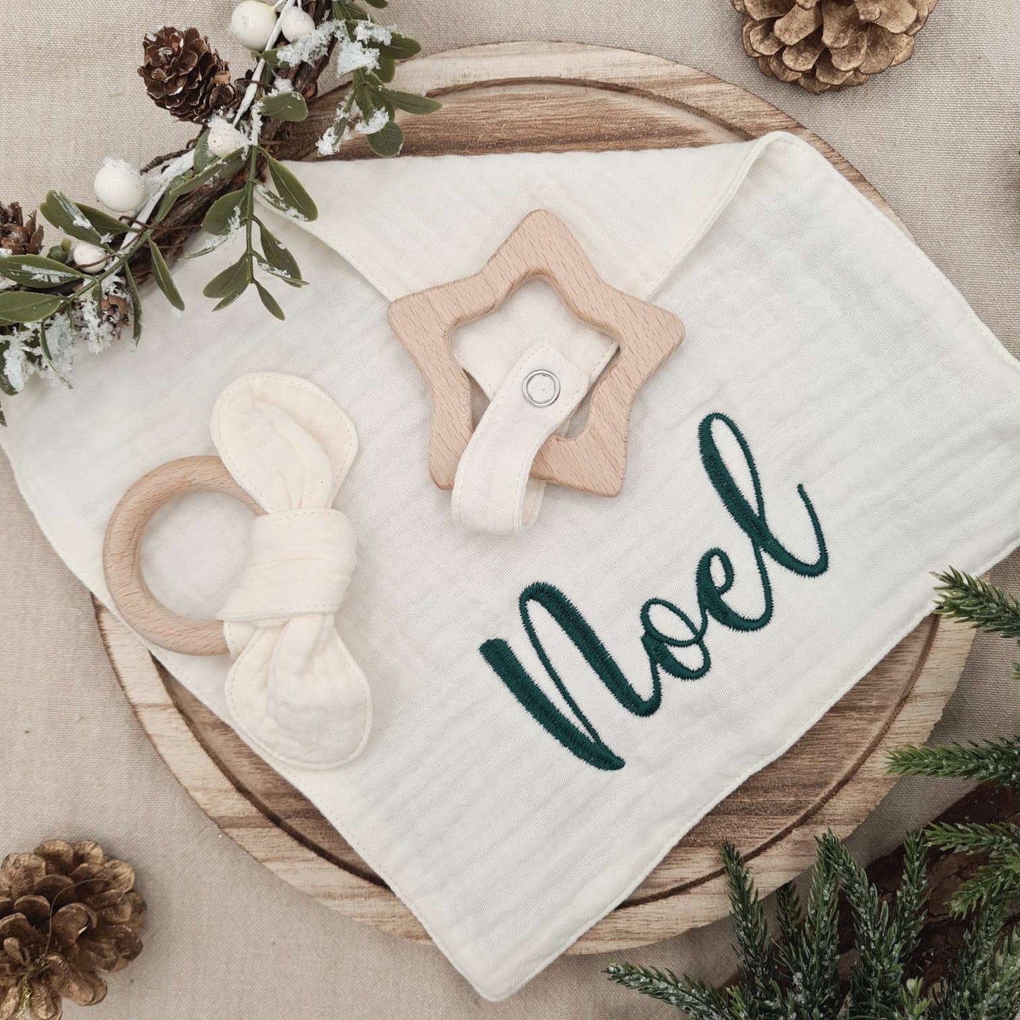 Cute Christmas-themed animal ring attached to the Muslin Comforter for baby's play.