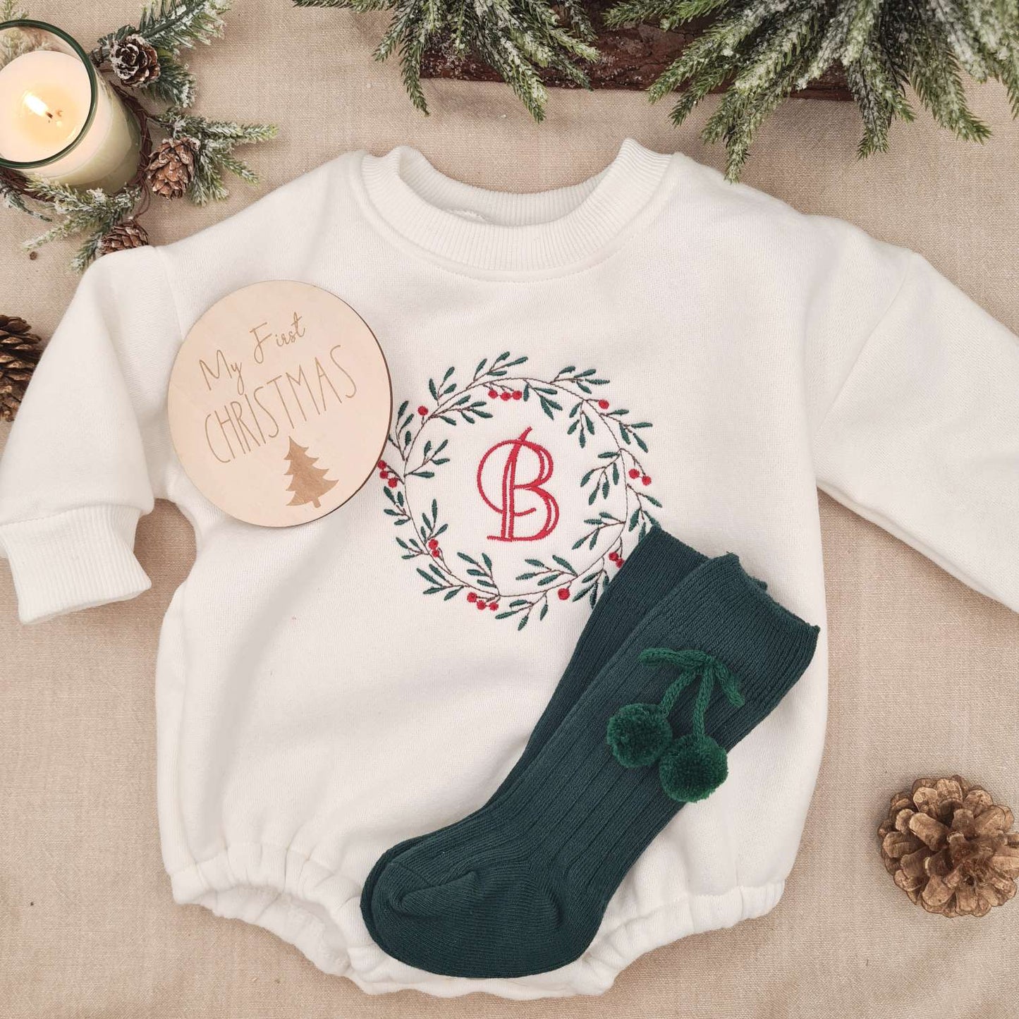 Option of green socks paired with the Christmas Wreath Embroidered Baby Romper.