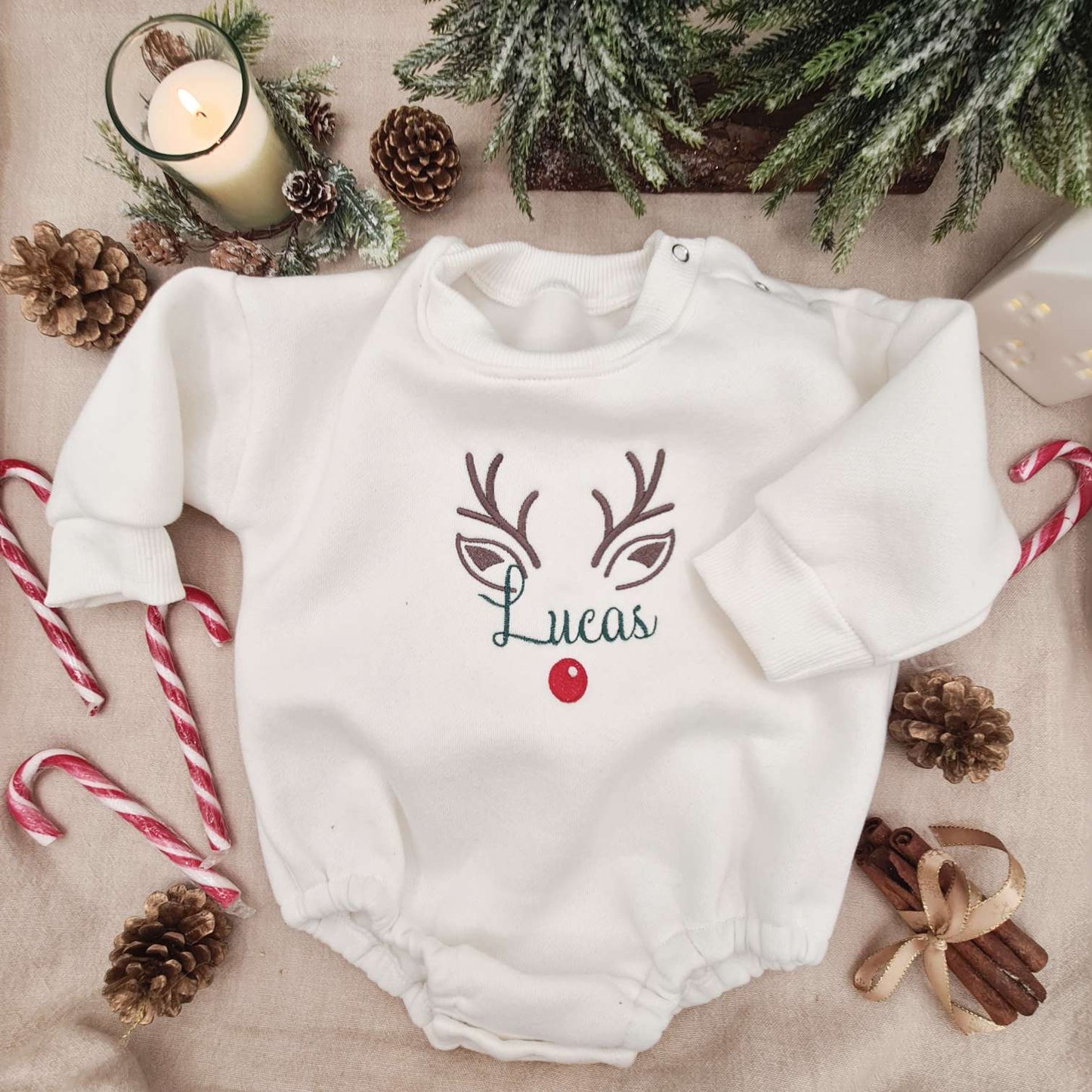 Festive Christmas setting featuring the Embroidered Reindeer Baby Romper.