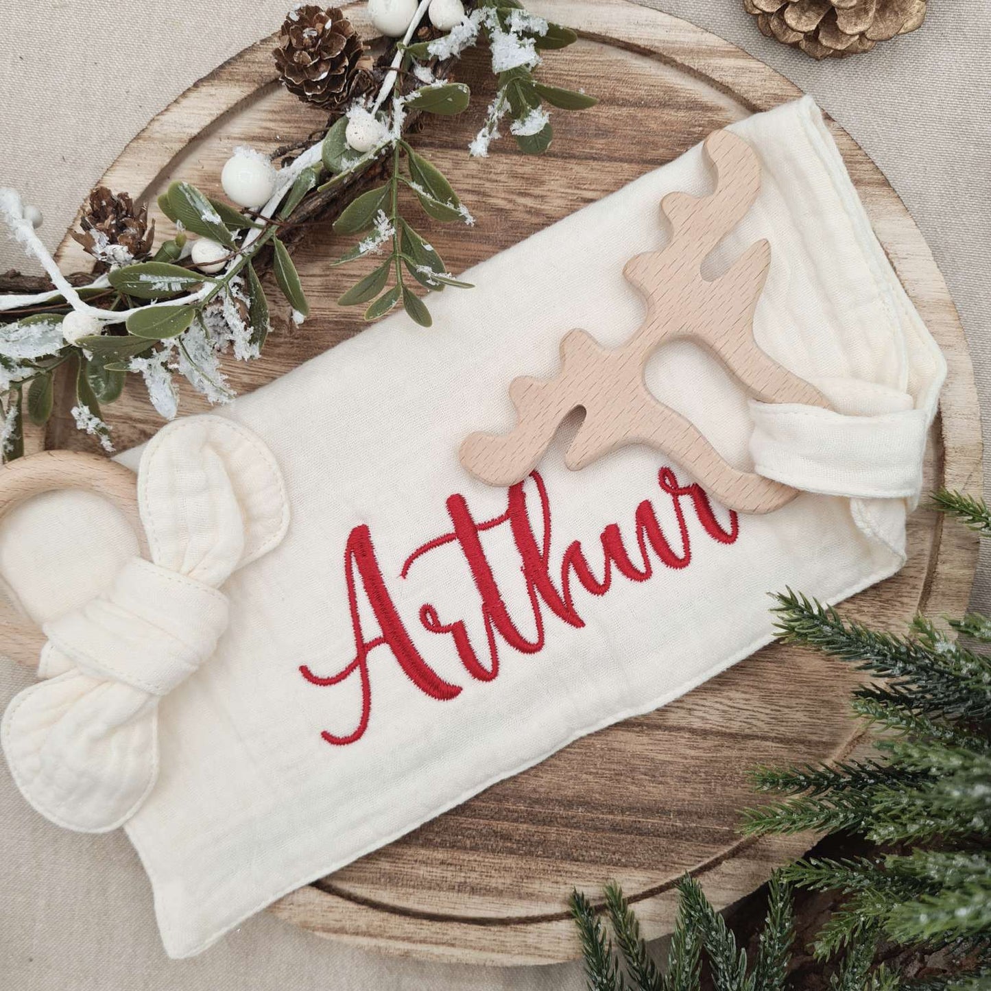 Personalized Muslin Cotton Comforter with baby's name in red festive embroidery.