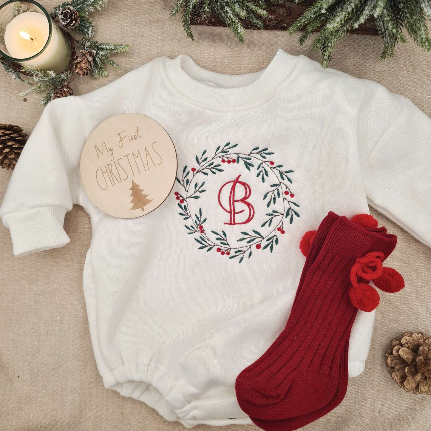 Matching red socks complementing the Monogrammed Christmas Wreath Baby Romper.