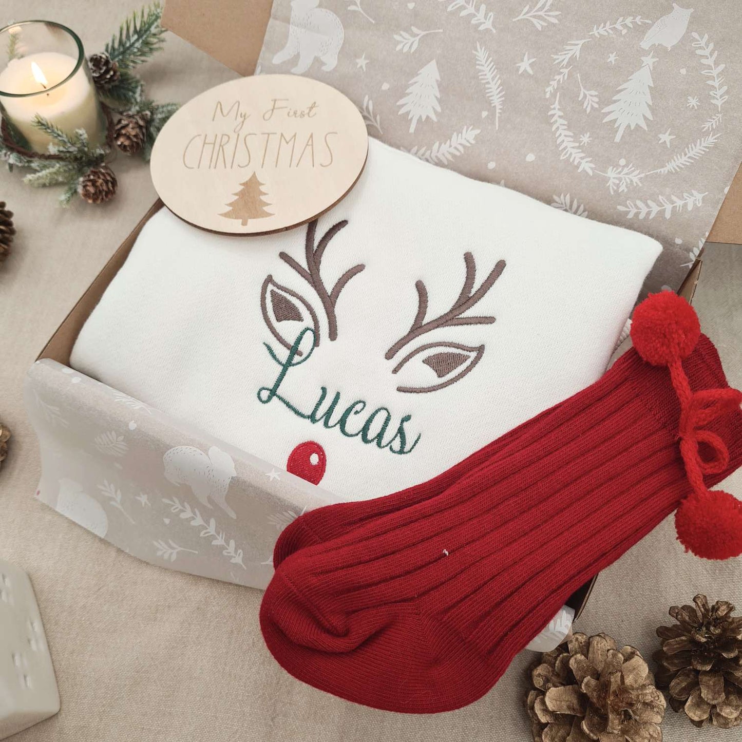 Side view of the soft fleece Baby Romper showcasing the reindeer embroidery.