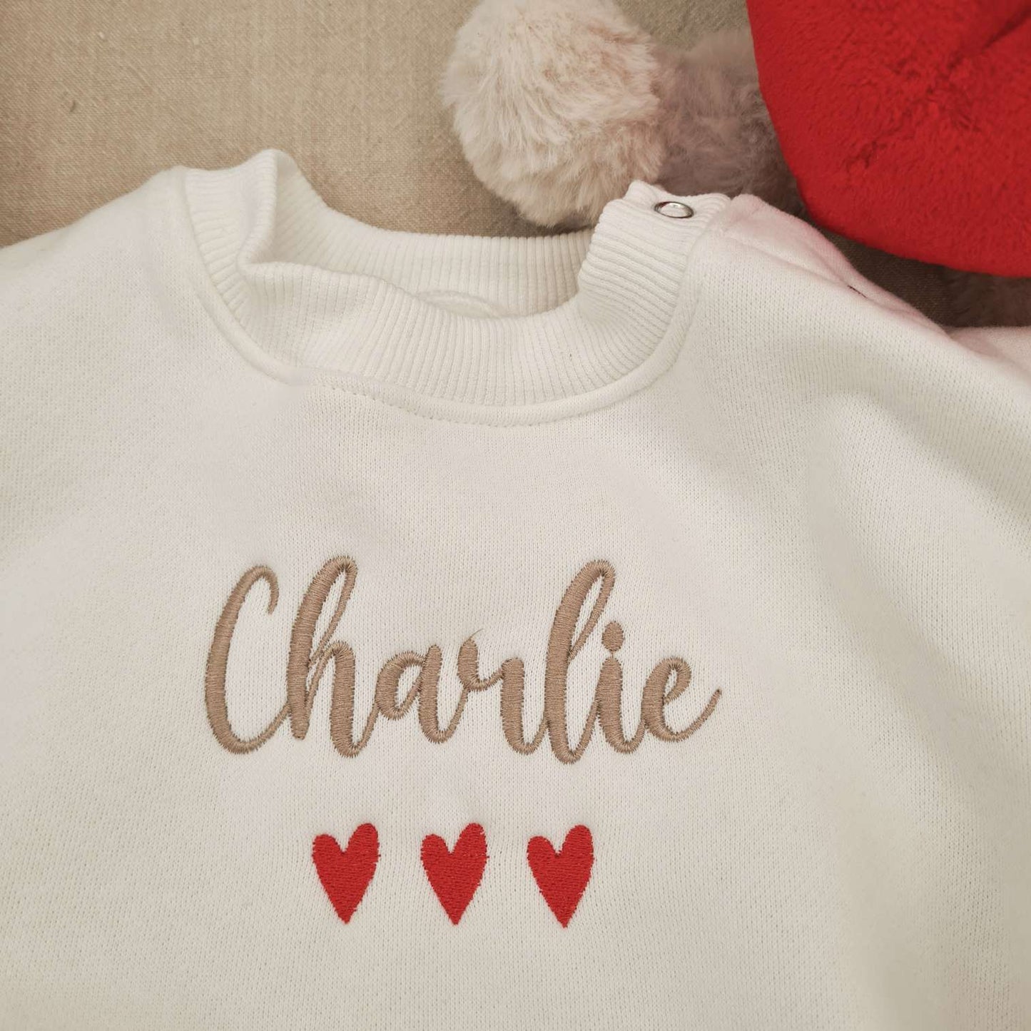 Close-up of Embroidered Name on Valentine's Day Baby Romper