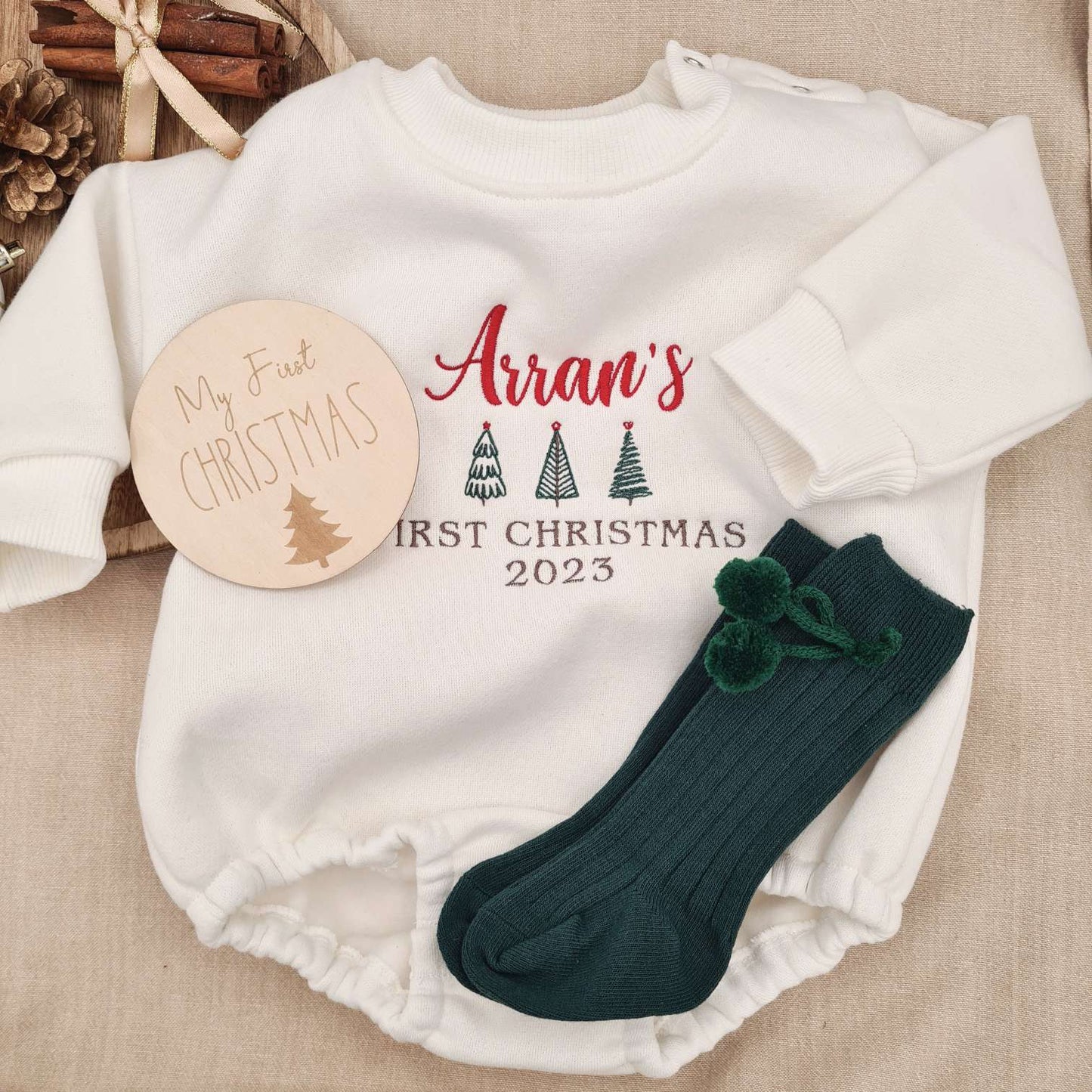 Green socks variant alongside the Embroidered Baby Romper.