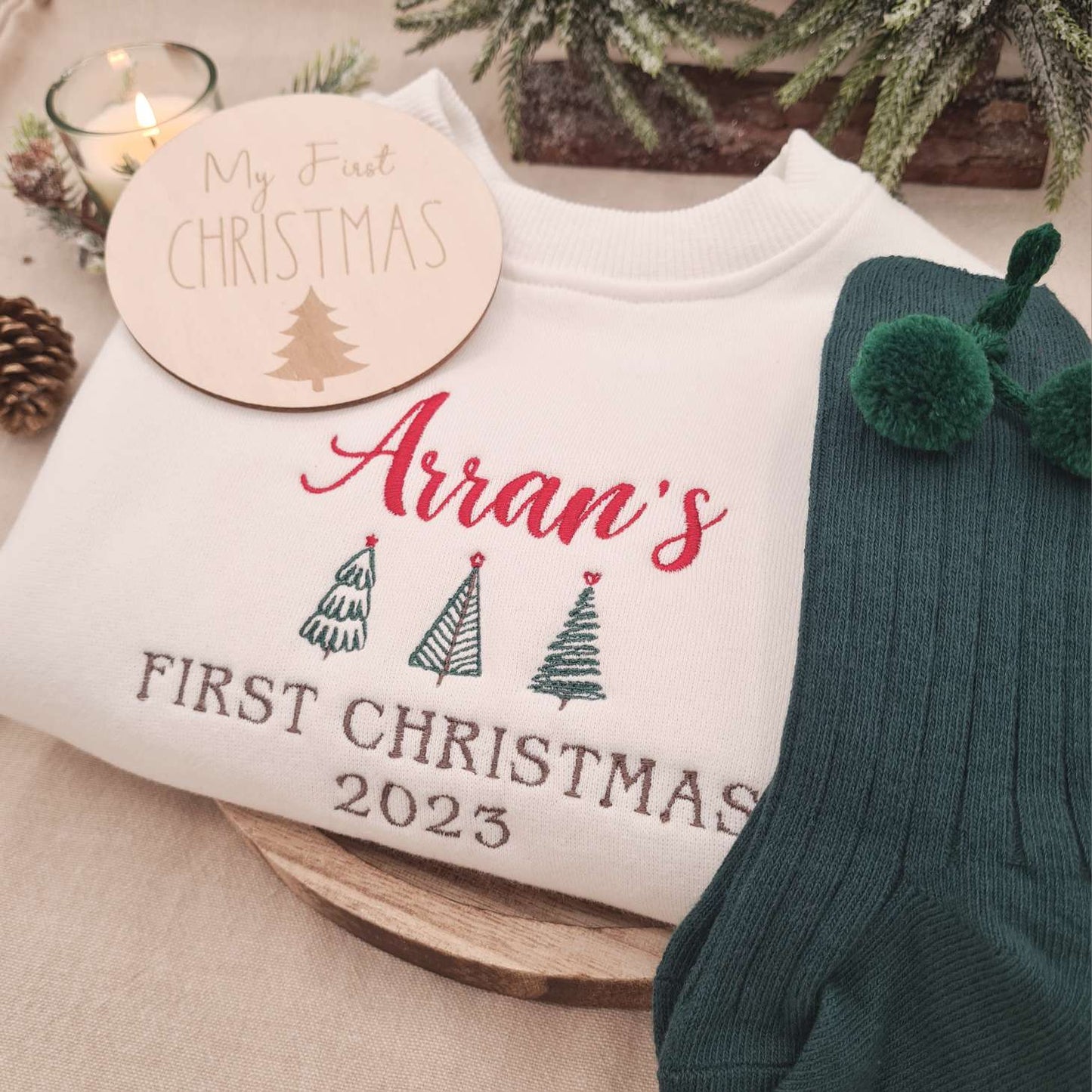 Lifestyle shot of the Baby Romper in a festive Christmas setting.