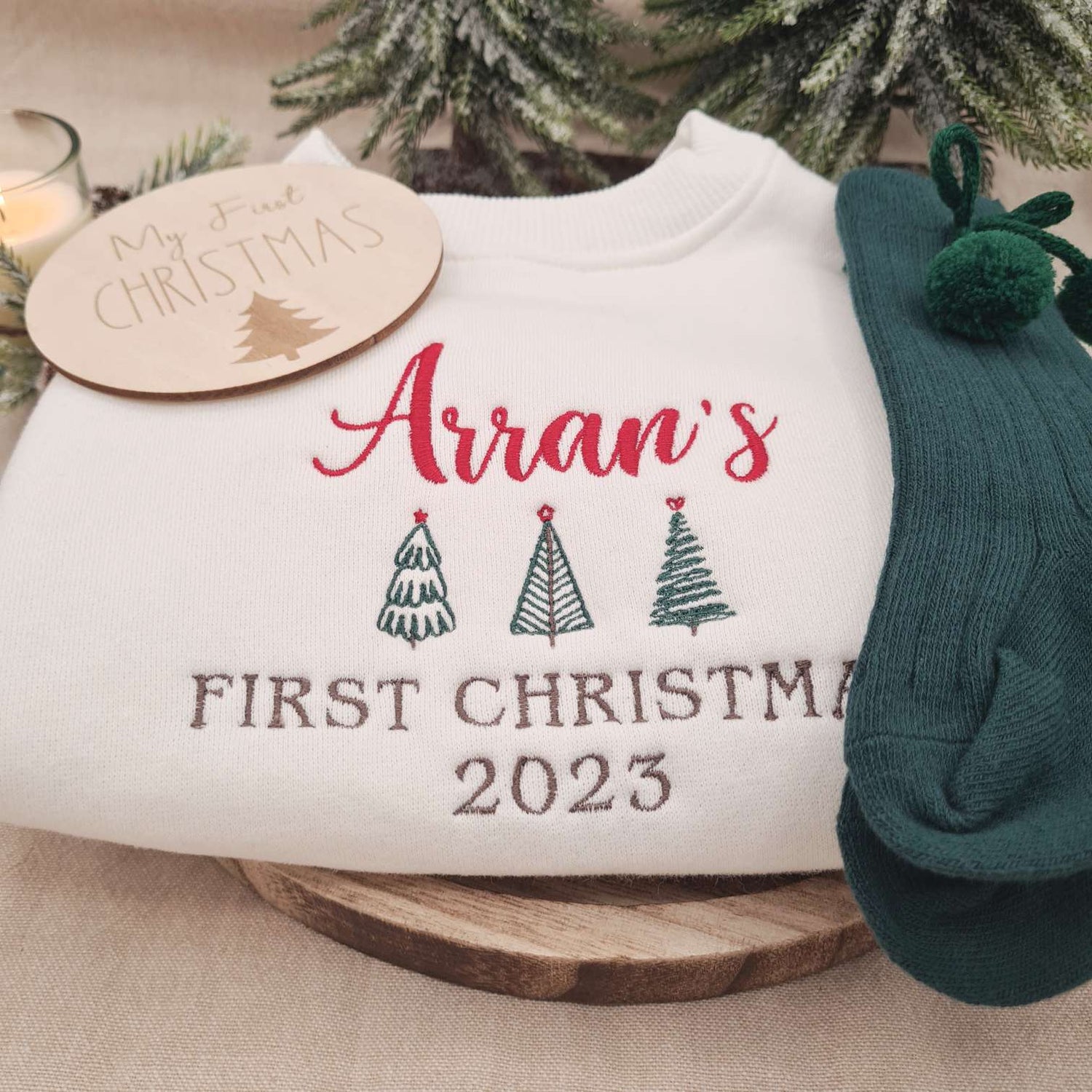 Full view of the off-white Embroidered Baby Romper with Christmas tree designs.