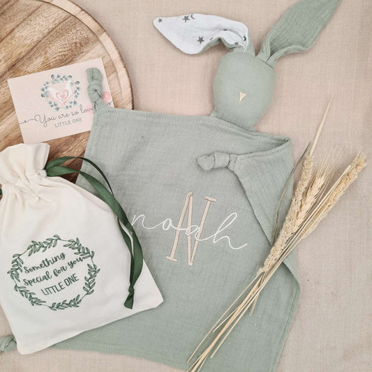 Personalised green bunny comforter with embroidered name 'Noah' and gift bag, perfect for newborns and baby showers. Gift-ready with Gift Bag and Gift Card.