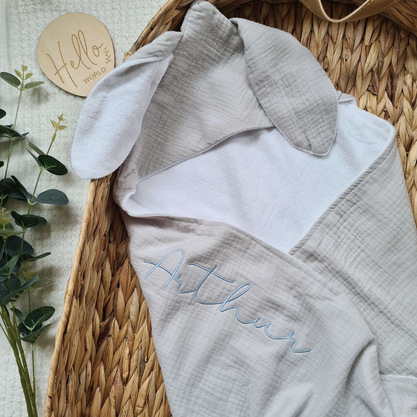 Grey hooded baby towel with bunny ears and embroidered name 'Arthur'. Perfect for baby bath time, made from muslin and terry cotton.