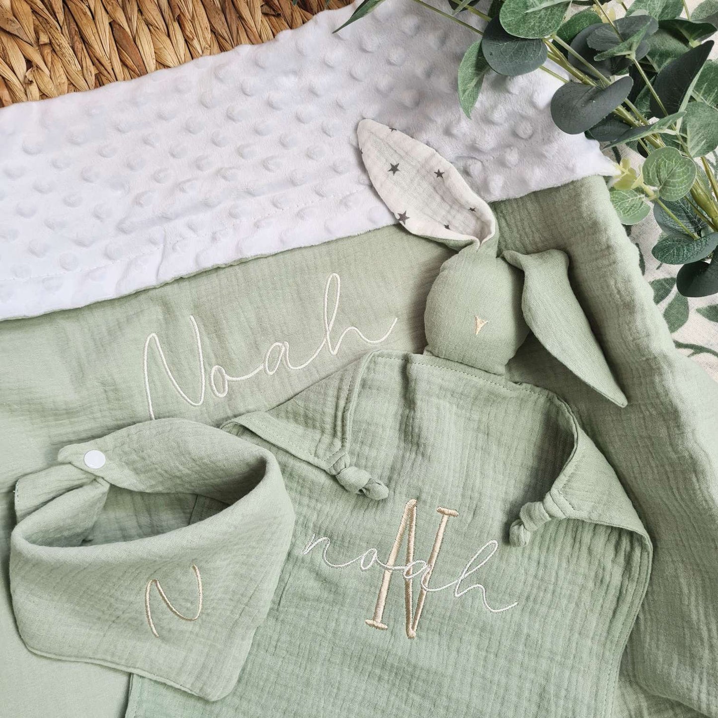 Personalised baby blanket gift set in green, with embroidered name 'Noah'. Includes a soft muslin blanket, bunny comforter, and bib.