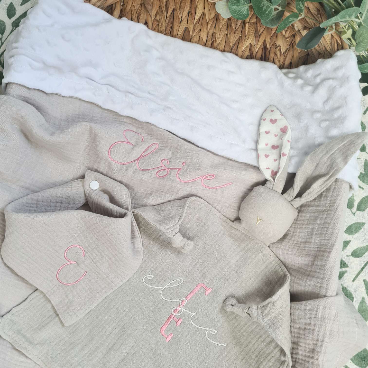 Personalised baby blanket gift set in grey, with embroidered name 'Elsie'. Includes a cosy blanket, matching bunny comforter, and bib.