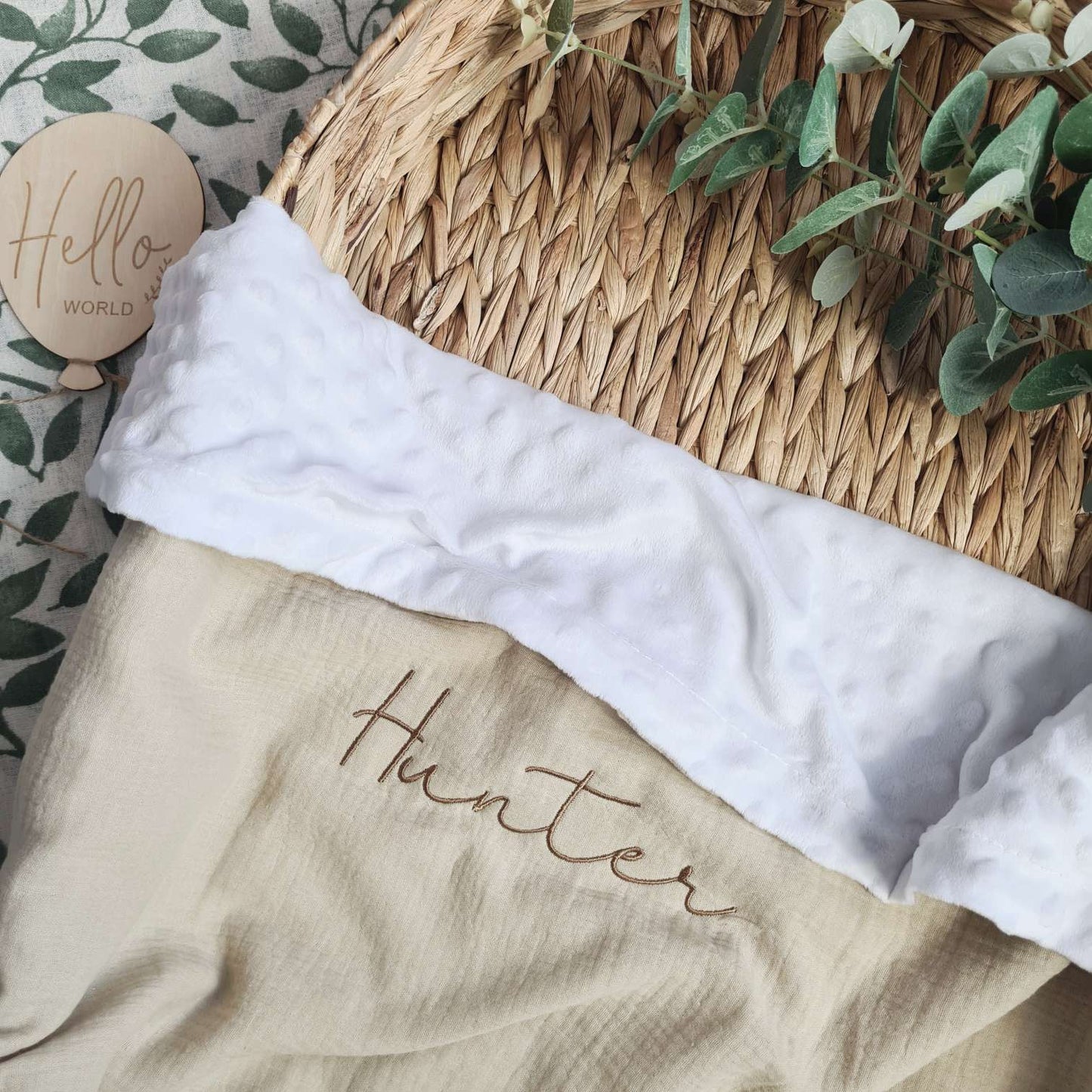 Beige personalised baby blanket with white plush trim and embroidered name 'Hunter'. Soft and cosy for newborns.